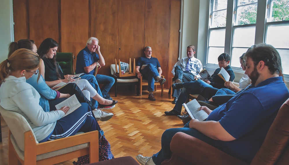 The UWF Group Gathered Around Enjoying Each Other's Company