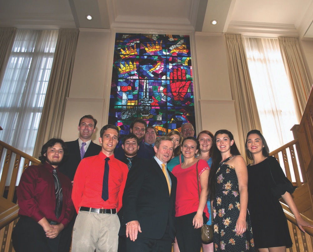 UWF Irish Experiece Program Students Gathered In A Group Picture In Front Of A Vibrant Glass Stained Window