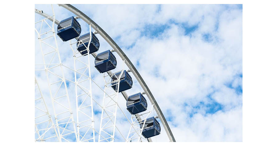 Tight Shot Of Navy Pier's Cennenial Ferris Wheel's Blue Gondolas