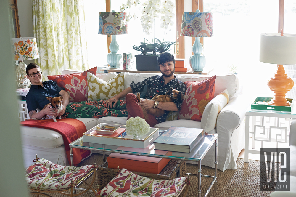 Christian Siriano and Brad Walsh posing in their living room with dogs Connecticut Home Bed Bath and Beyond floral print design interior