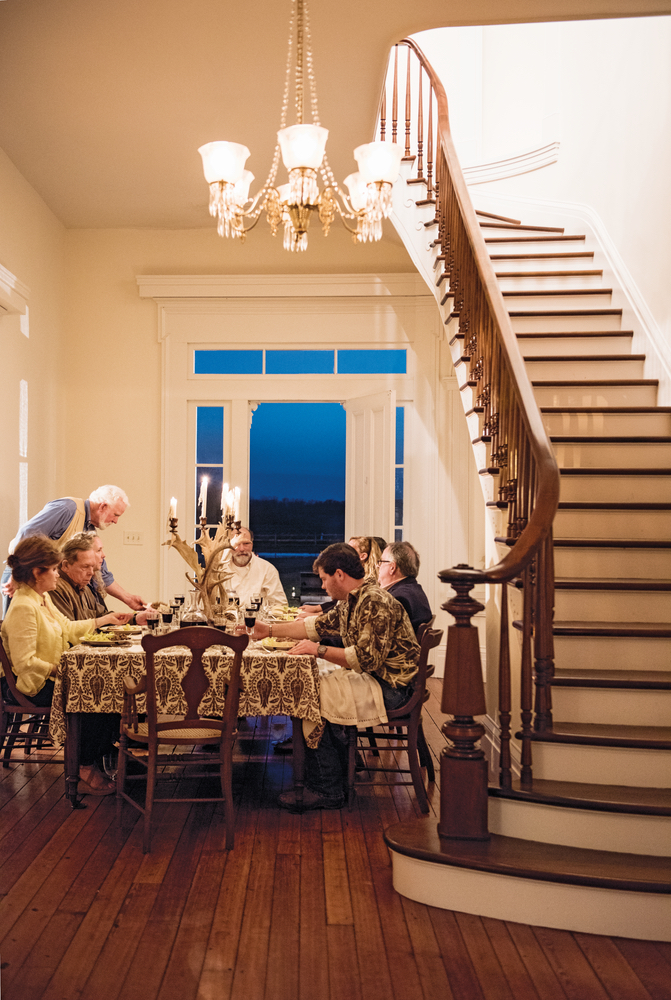 Julia Reed: At Home in the South dinner table setup in foyer under the staircase
