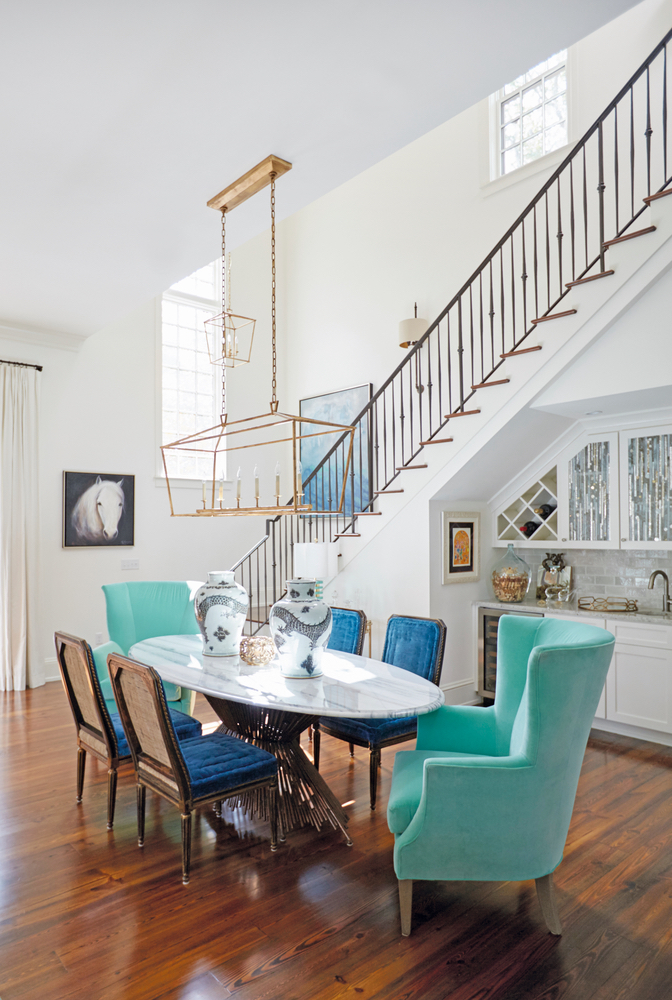 Susan Lovelace Destin Home dining table blue chairs staircase