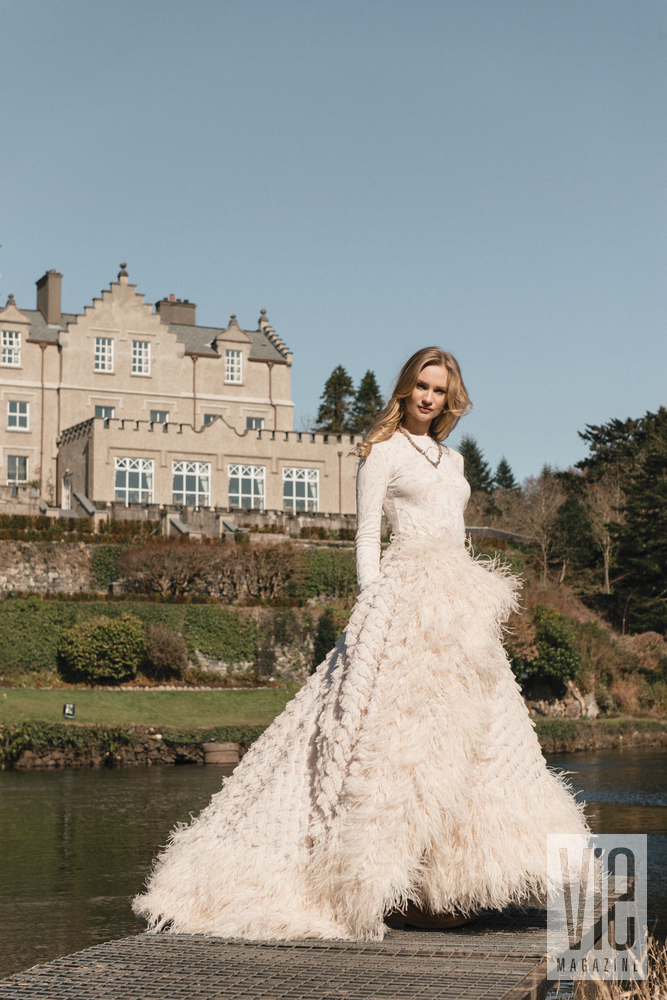Irish model Clara McSweeney in front of Ballynahinch Castle in Christian Siriano gown