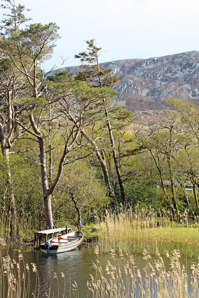 Boat by Kylemore Abbey with mountain in background Connemara Life 2016