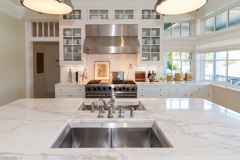 Beautiful clean white kitchen with gorgeous countertops Erin Oden The Sophisticate Issue 2016