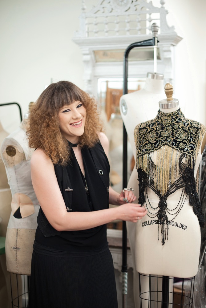 Designer Mimi Prober with one of her creations hand made detailed fashion Sophisticate 2016