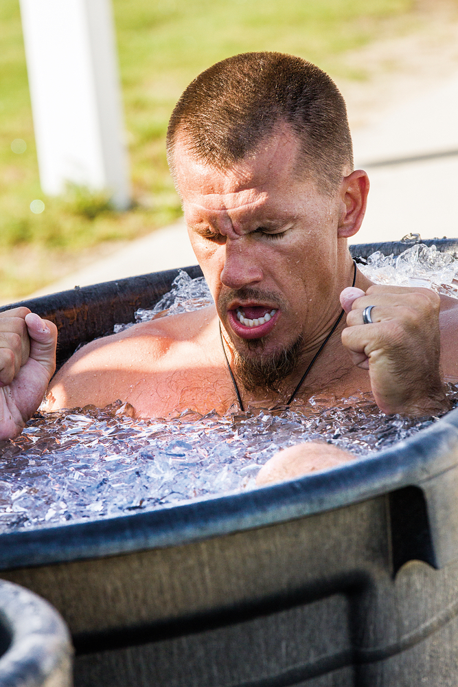 Man in an ice bath to prevent injury focus determination healthy living VitalityPro