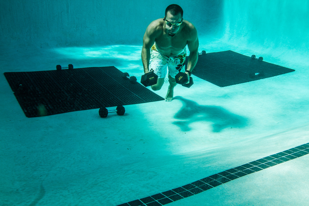 Man swimming with weights VitalityPro exercise healthy living