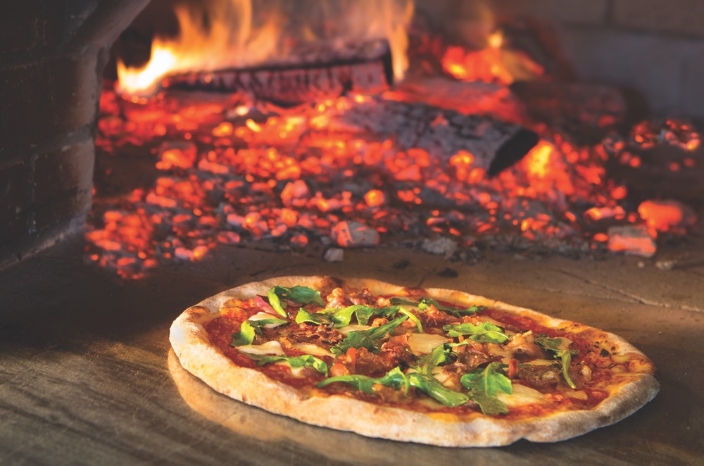 Wood-fired brick oven pizza served at the Acme Ice House, The Village at Seacrest Beach on Scenic Highway 30-A