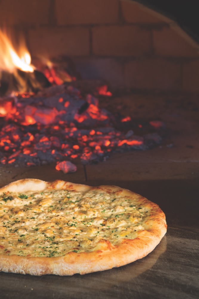 Wood-fired brick oven pizza served at the Acme Ice House, The Village at Seacrest Beach on Scenic Highway 30-A