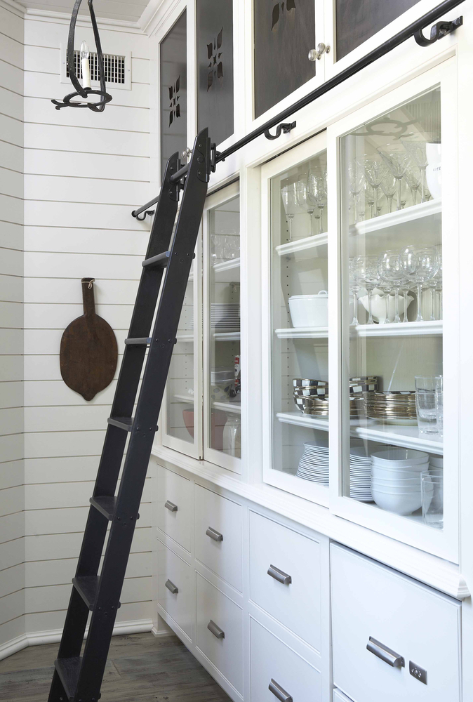 Cabinet for dishes with a ladder in a Lake Martin home 2017