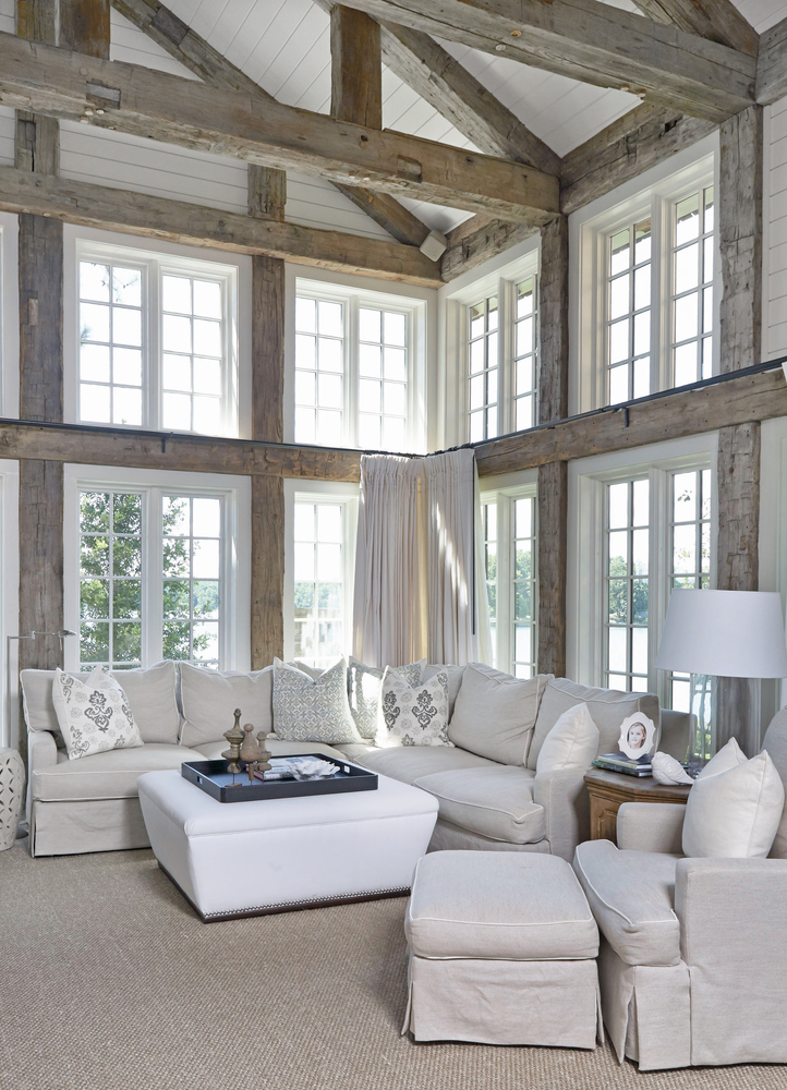 Living area with lots of windows for natural lighting in Lake Martin Home