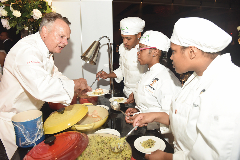 Celebrity chef Frank Stitt mentoring young student chefs at Carnivale du Vin in NOLA
