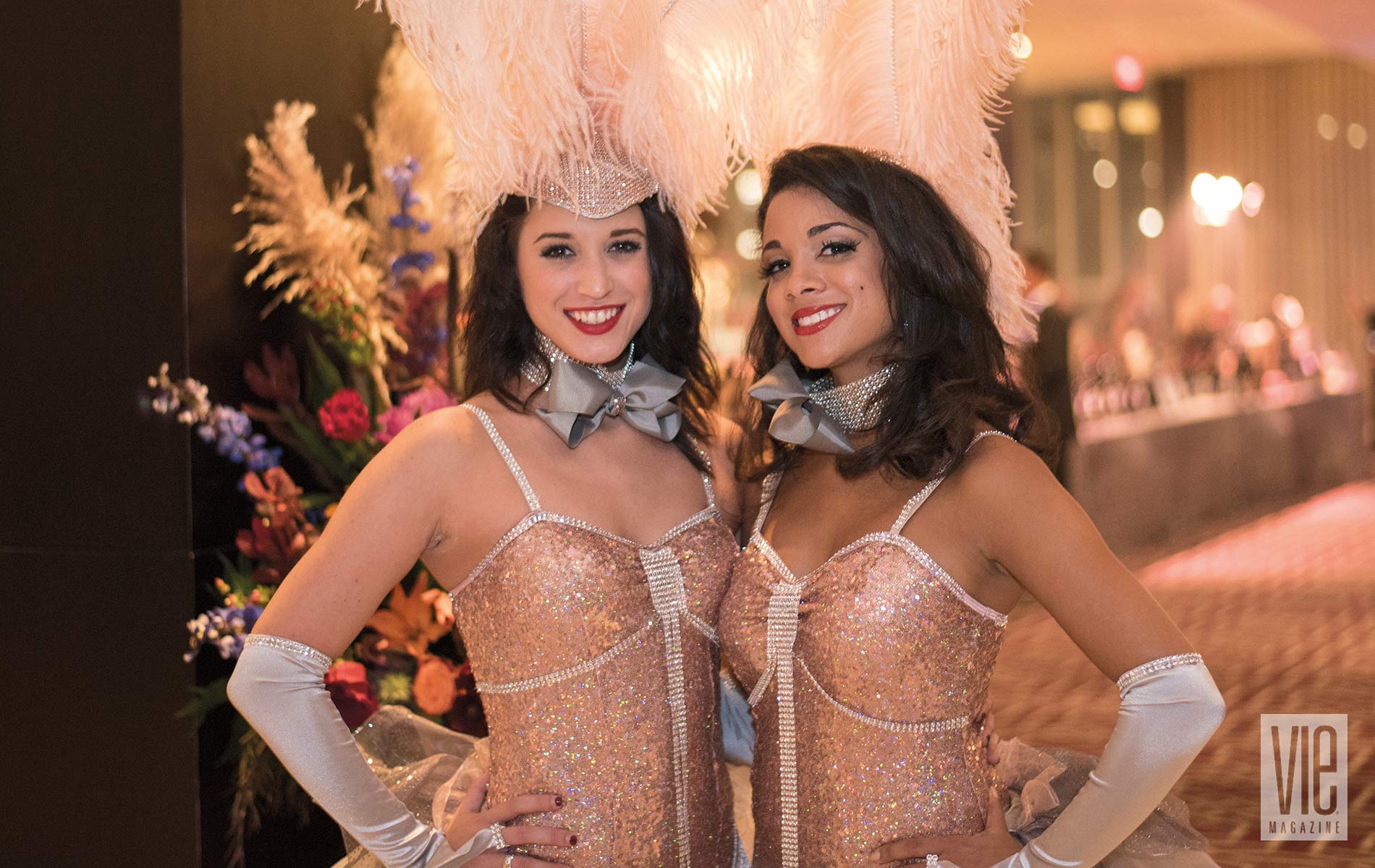 The Carnivale showgirls parading throughout the banquet hall and taking photos with guests provided a fun ambience in keeping with the theme of the evening. Photo by Gerald Burwell.