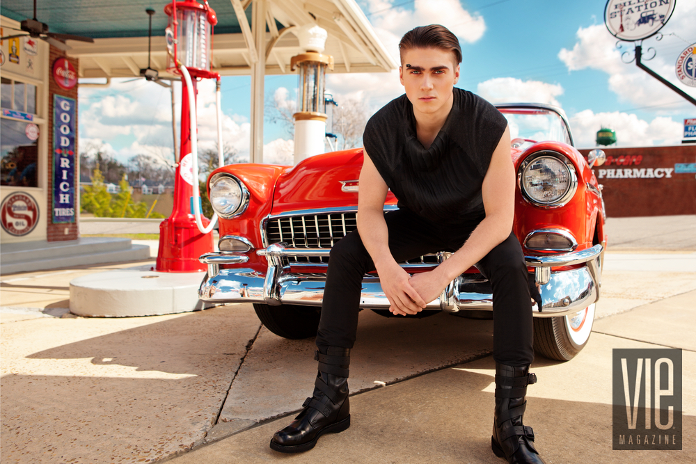 Jordan sitting on the hood of the red car Dystopia meets Utopia SWFW 2017