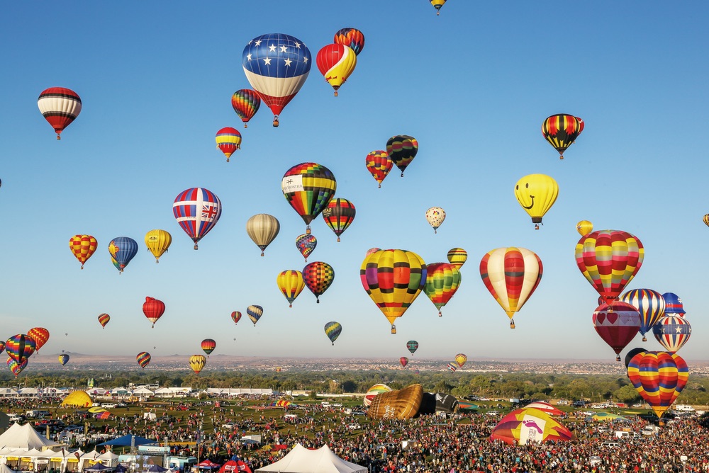 Take a ride and discover the world’s biggest hot-air balloon event in our Voyager feature, “Up, Up, and Away.” Photo by Bennie Bos.