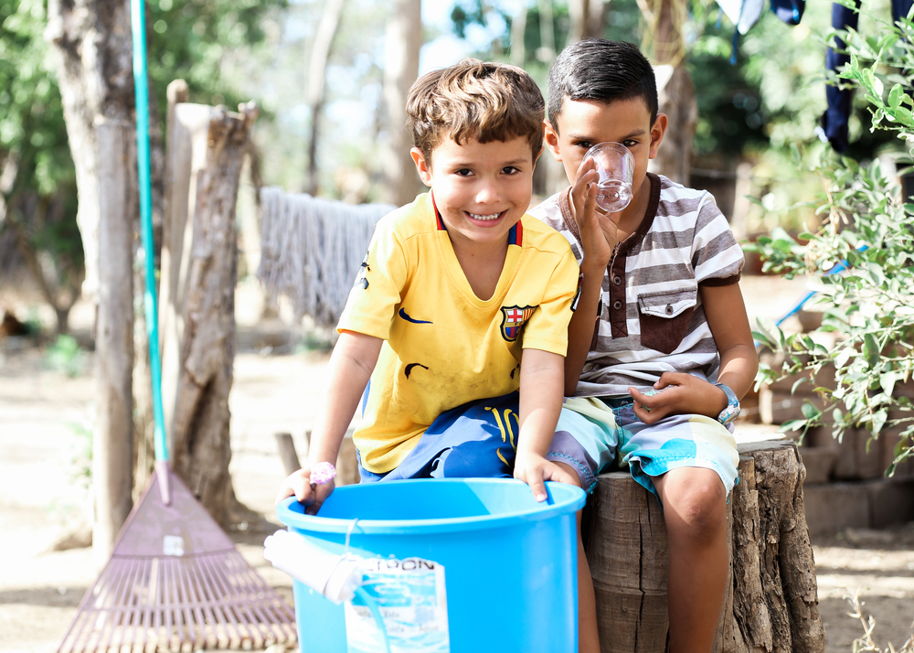Kids playing and drinking clean water Filter of Hope Nicaragua