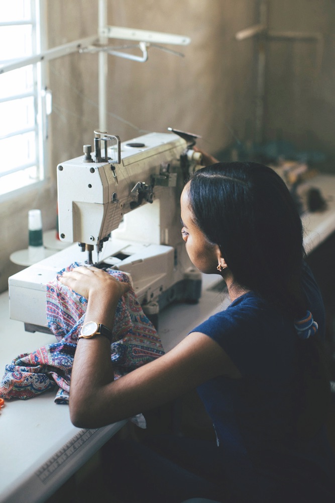 Girl working with sewing machine, OKO Lifestyle