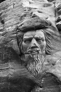 Merlin carving in castle ruins at Cornwall England