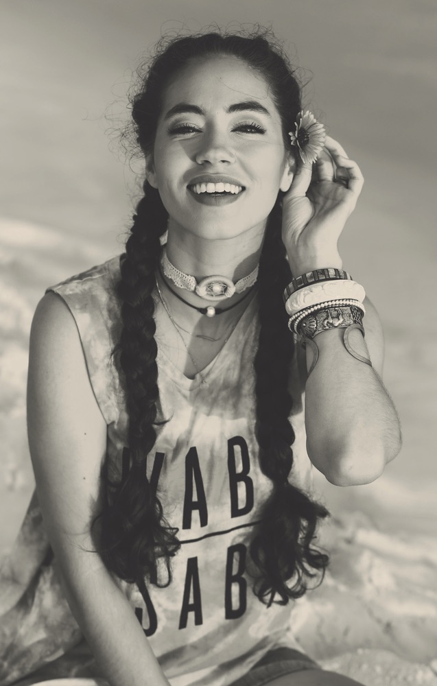 Model on the beach wearing a Graceful Rebel tank Wabi Sabi inspiring women