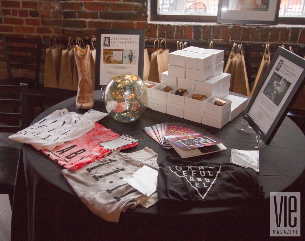 Raffle items from Annie Parker Jewelry and Graceful Rebel at VIE Magazine's "Stories with Heart and Soul" tour at The Listening Room Cafe to benefit Alaqua Animal Refuge
