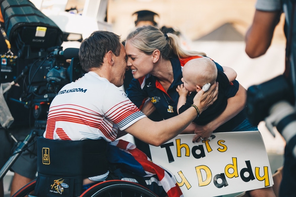 United Kingdom WheelChair Tennis player embraces wife and child after match at the Invictus Games 2017 Toronto