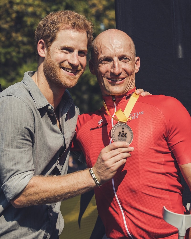 Prince Harry congratulates bronze medalist Thomas Stuber of Germany after Stuber competed in the cycling time trial at the Invictus Games 2017 Toronto