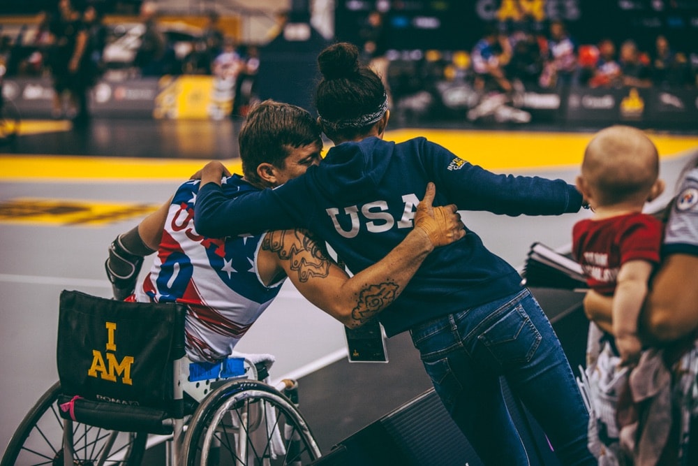 Member of the USA Wheelchair Basketball team gives hug to his supporter in the stands at the Invictus Games 2017 Toronto