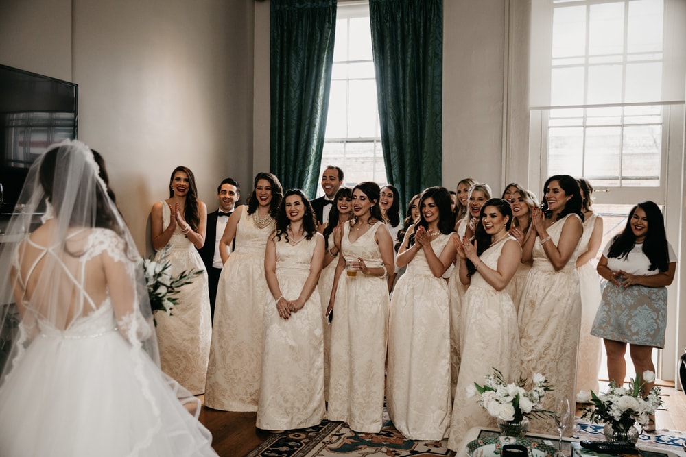 Sarah Elizabeth's bridesmaids see the bride in her gown for the first time