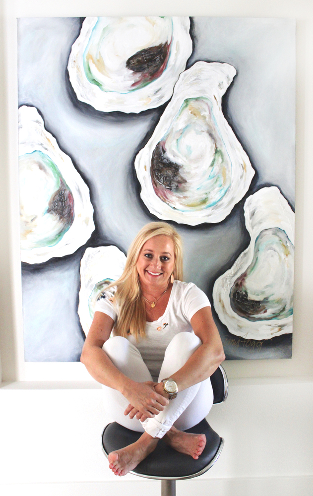 Portrait of artist Amy Fogg in front of her oyster painting