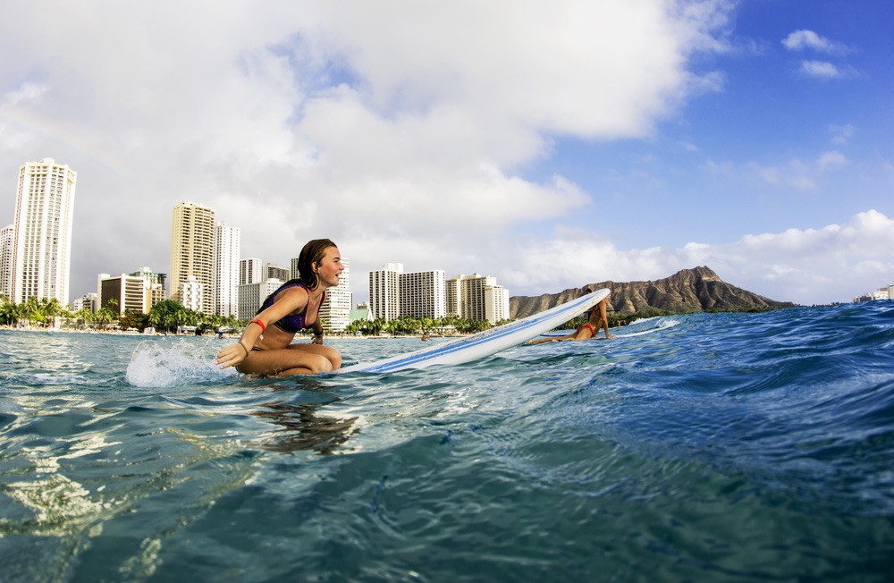 surfers wait for breaking waves off Waikiki Beach, Hawaii