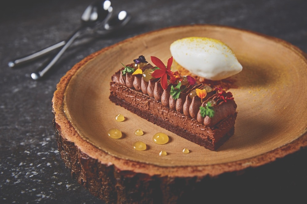 If you’ve got a sweet tooth, stop by Stubborn Seed for the croustillant, a decadent chocolate layer cake. Photo courtesy of Grove Bay Hospitality