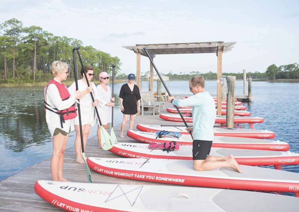 Stand-up paddleboarding lessons with RUN/SUP at WaterColor Boathouse at The Southern C Retreat in WaterColor Florida