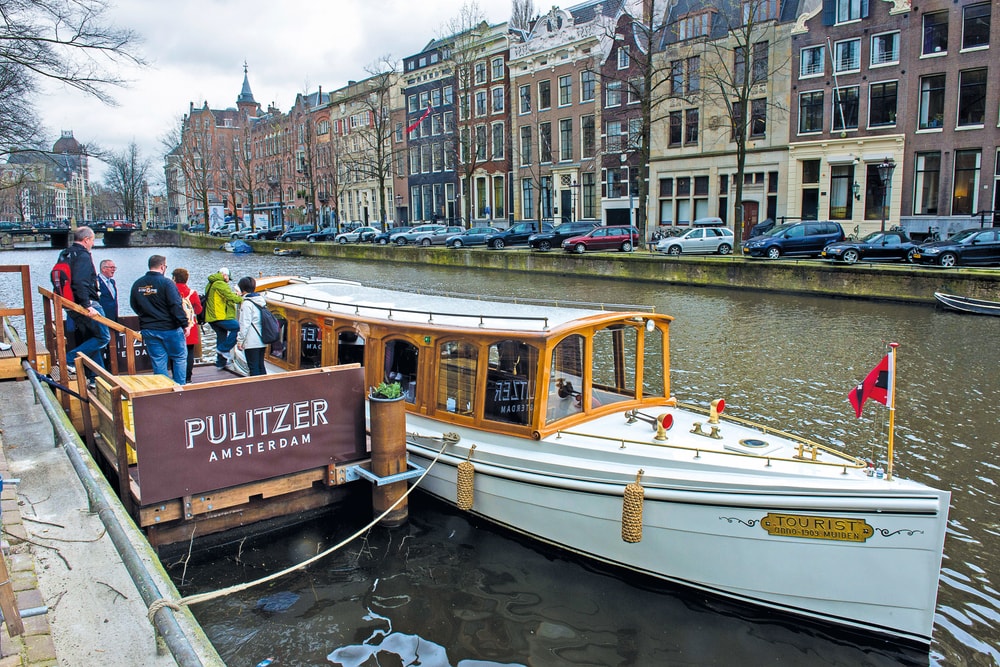 Jordaan Food and Canal Tour participants board the salon boat, The Tourist Amsterdam Food VIE Magazine Destination Travel 2018