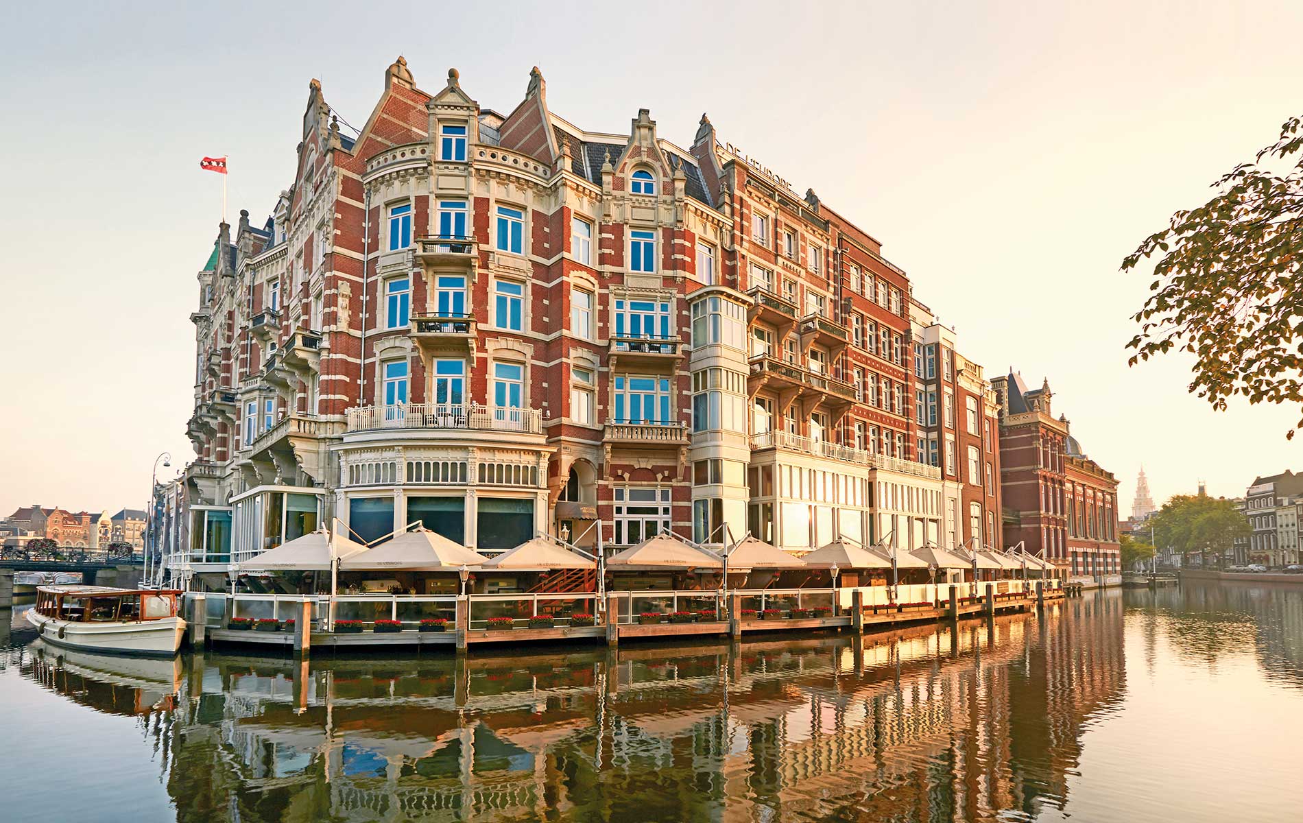Exterior shot of De L’Europe Amsterdam, a five-star luxury hotel on the Amstel River | Photo courtesy of De L’Europe Amsterdam
