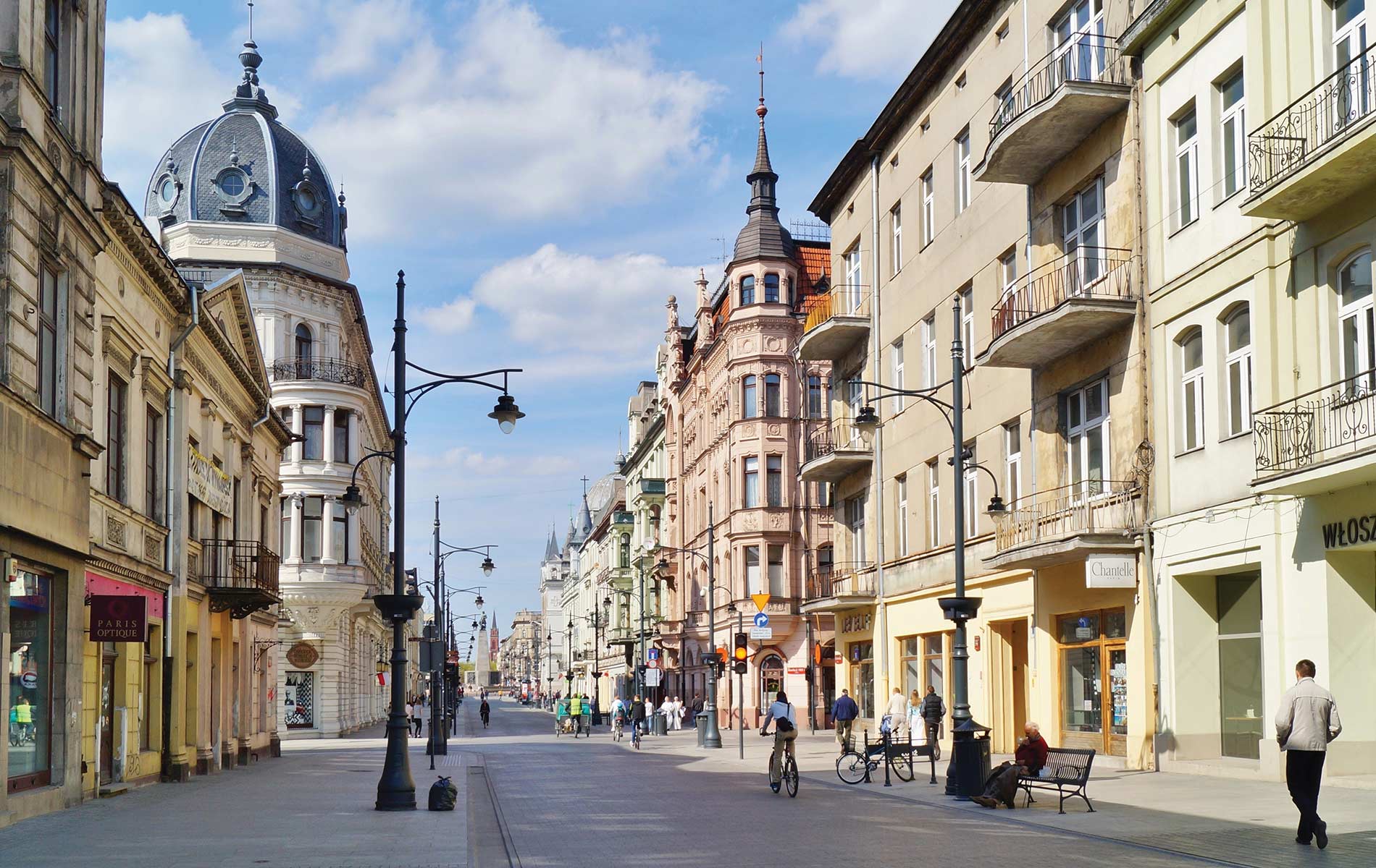 Passersby enjoy a sunny Sunday afternoon on Piotrkowska Street in Lodz. Photo by Mariola Anna S / Shutterstock