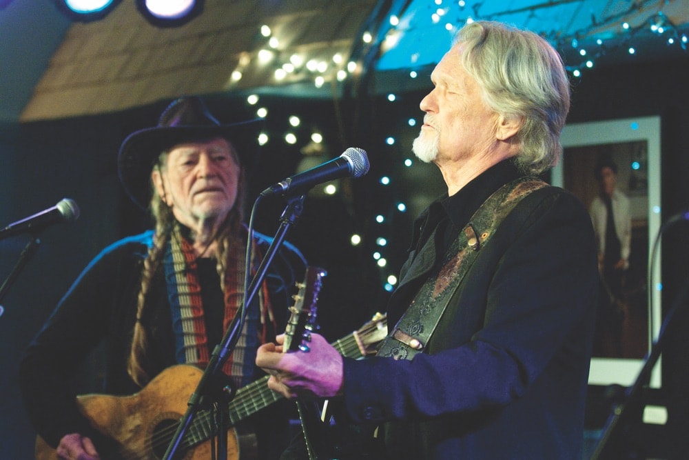 Country legends Willie Nelson and Kris Kristofferson perform at the Bluebird Cafe. Photo courtesy of Bluebird Cafe
