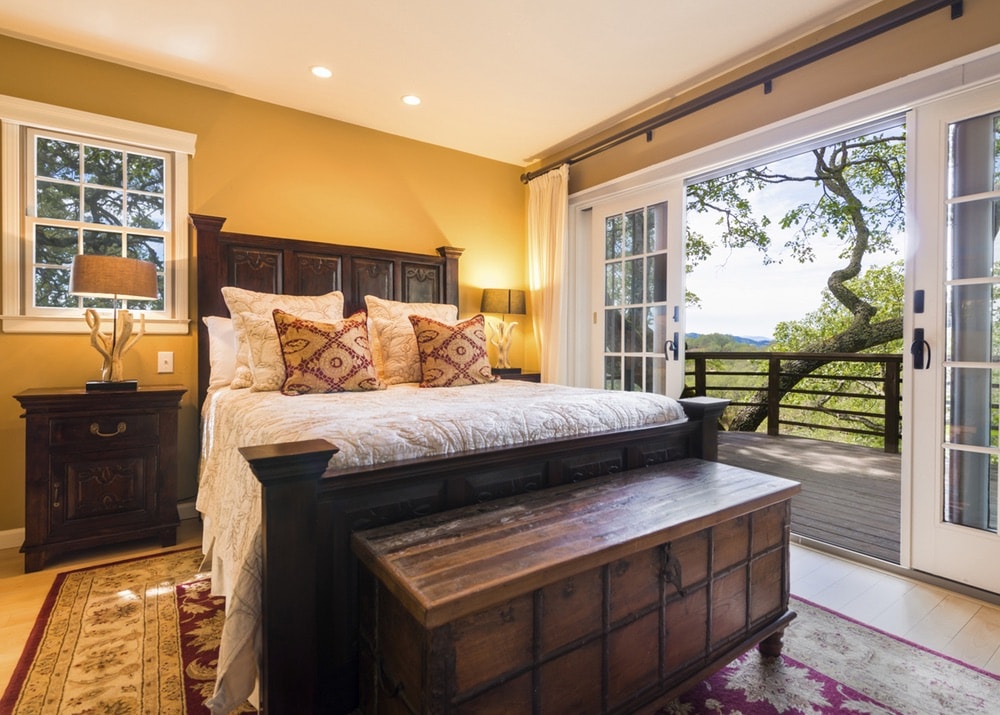 Jordan Vineyard and Winery; One of the guest bedrooms with a view overlooking the vineyard in Sonoma County, California.