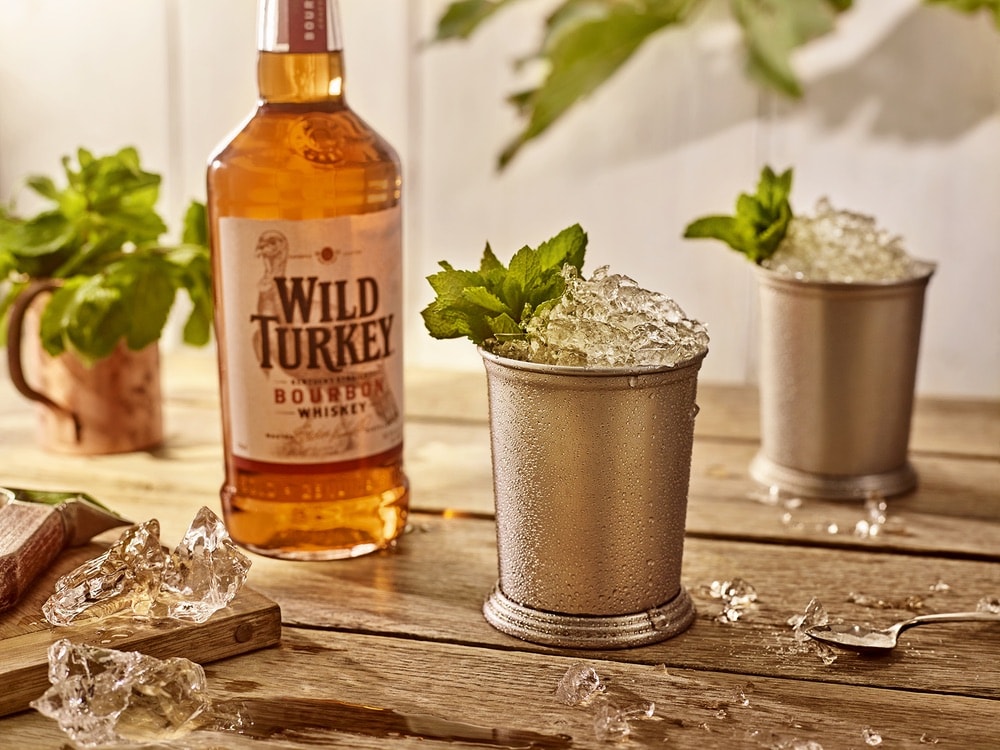 Mint Julep cocktails and a bottle of Wild Turkey