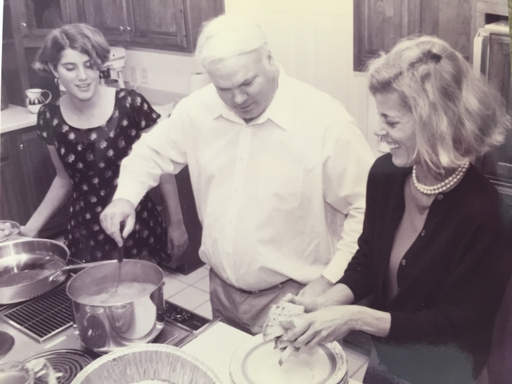 Caroline Pollak, Pat Conroy, and Suzanne Pollak cooking in the kitchen.