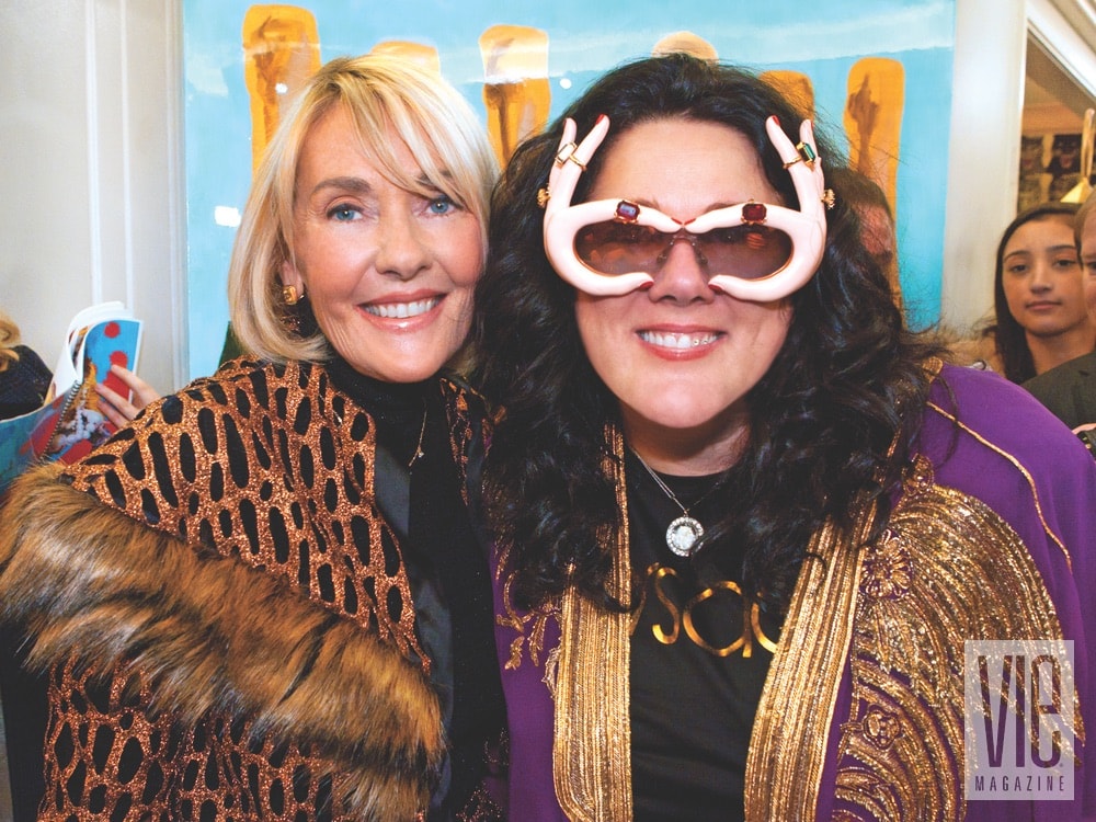 Lisa Burwell and Ashley Longshore at Ashley's pop-up grand opening on the seventh floor at Bergdorf Goodman on January 11, 2018. Photo by Carlo Pieroni 