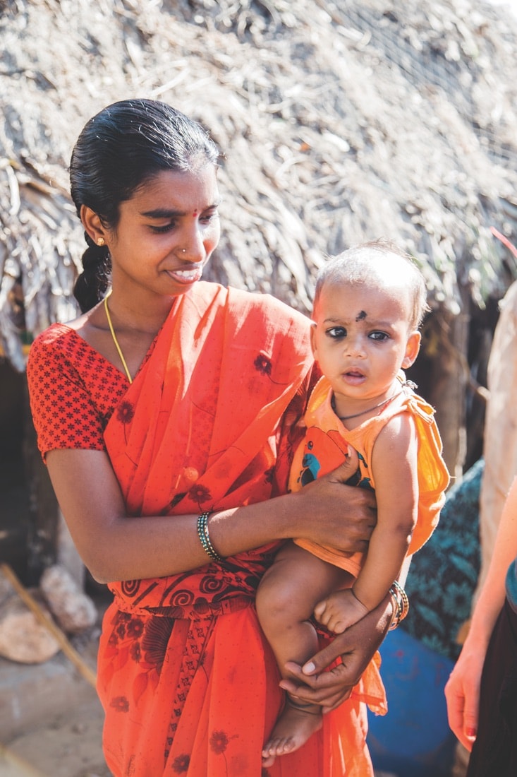 A mother and child in a rural village in India, VIE Magazine June 2018