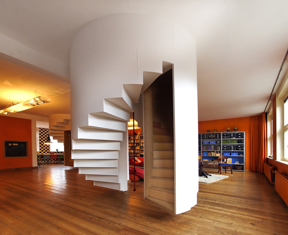 Back view of 1 set of the spiral staircases in the living room that leads to the boys' room upstairs.