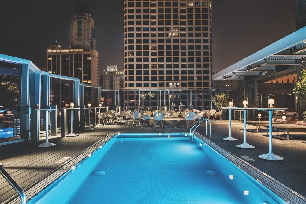 Devereaux, the rooftop pool and lounge at the Viceroy Chicago hotel, is a 1970s-chic spot for drinks and views of Lake Michigan.