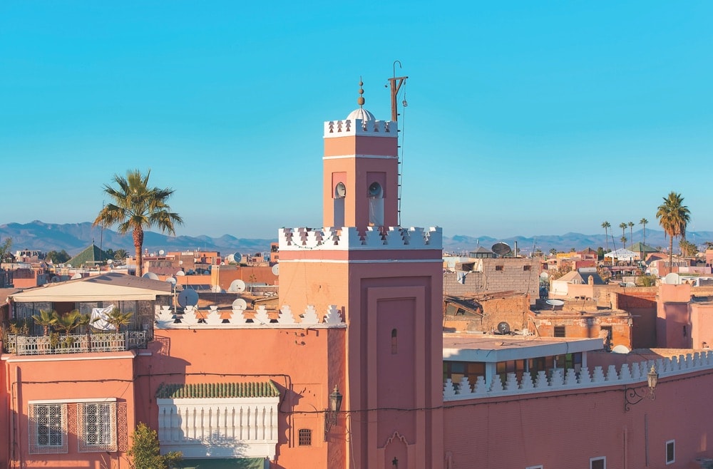 A panoramic view of Marrakech with a minaret standing above the old medina