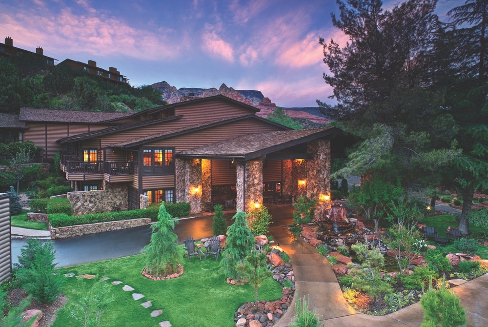 A view of the lodge building's exterior at sunset at L’Auberge de Sedona in Arizona.