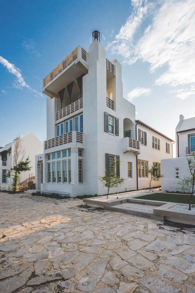 The Young Residence is another Alys Beach stunner, with high ceilings and vertical windows that draw the eye upward toward the rooftop, where a crow’s-nest lounge includes a fire pit, outdoor kitchen, and endless views.