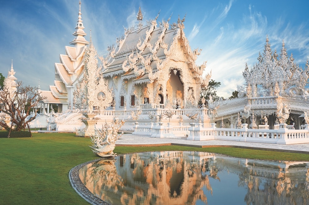 Beautiful ornate white temple located in Chiang Rai northern Thailand. Wat Rong Khun (White Temple), is a contemporary unconventional Buddhist temple.