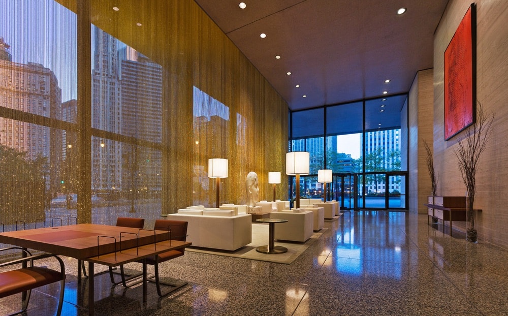 Floor-to-ceiling bronze beaded curtains and golden light make the space a luxurious sight from street level.