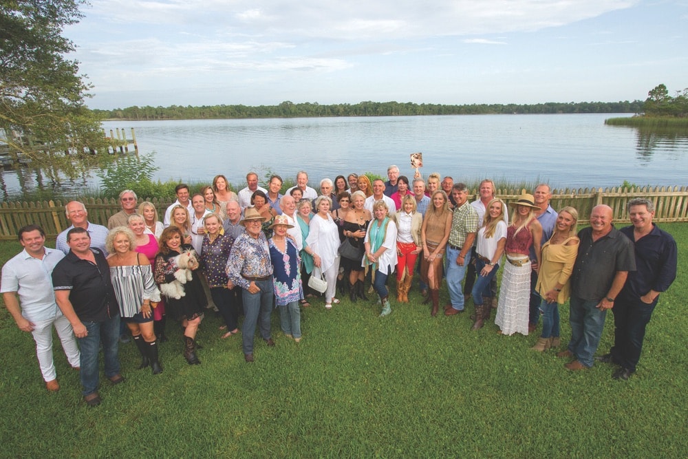 Patrons gather by the Choctawhatchee Bay at the home of Laurie and Taylor Hood for the Fifth Annual 100-Point and Cult Wine Dinner benefiting Alaqua Animal Refuge.